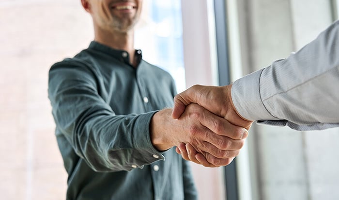 two people shaking hands